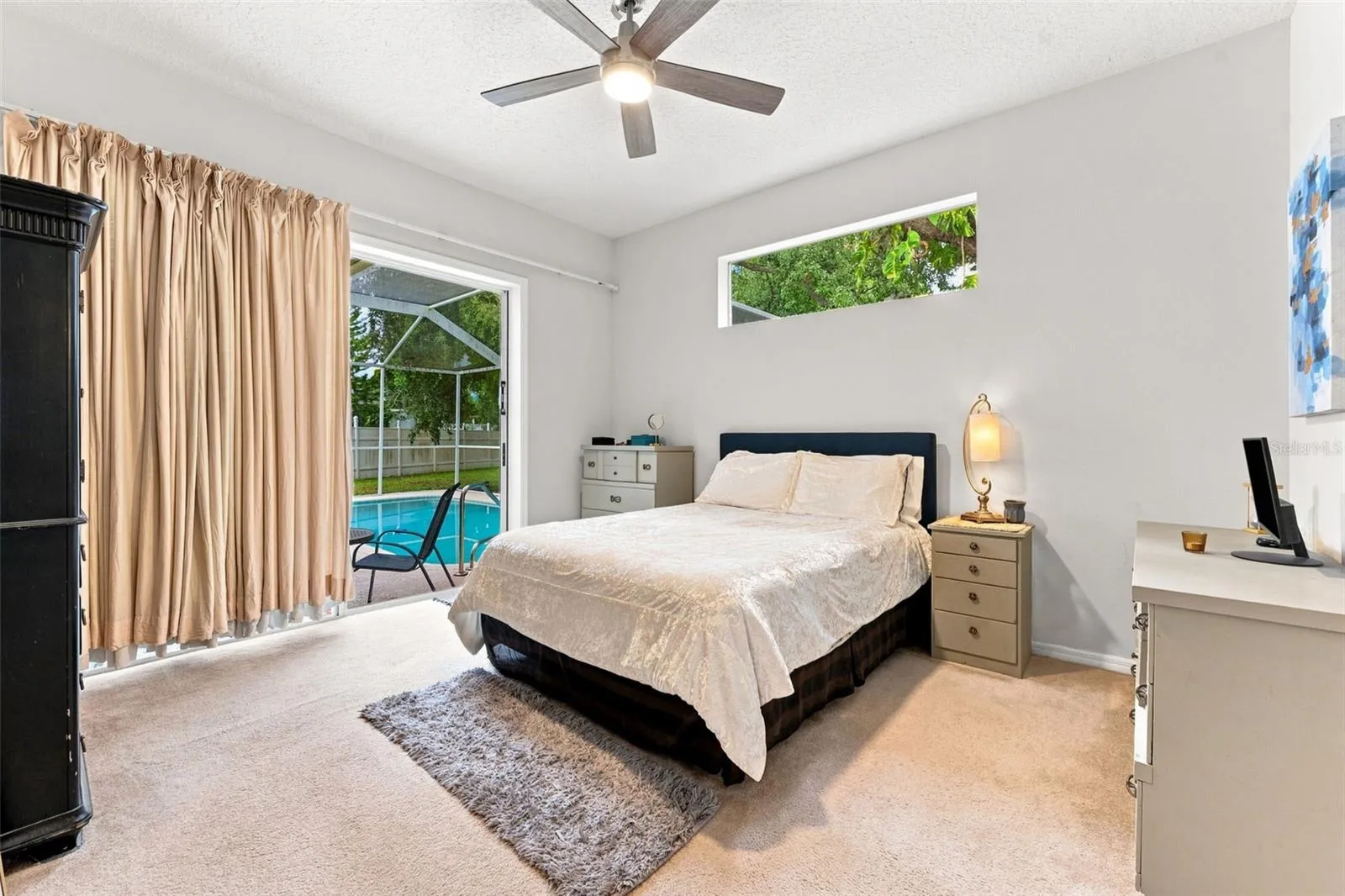 Primary bedroom with oversided walk-in close, en-suite bathroom with dual sinks and high ceilings