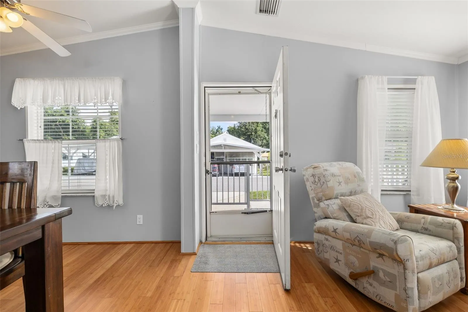 Vaulted ceilings, fans, and bamboo flooring in the open living space