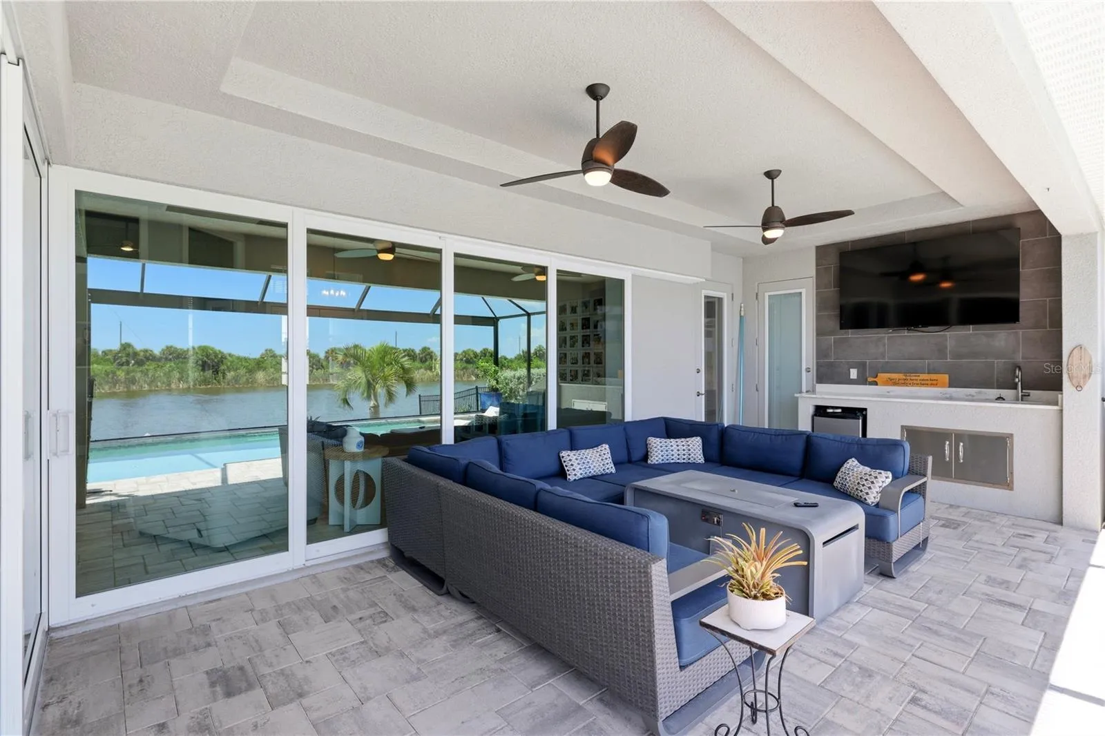 Outdoor covered pool deck with outdoor kitchen