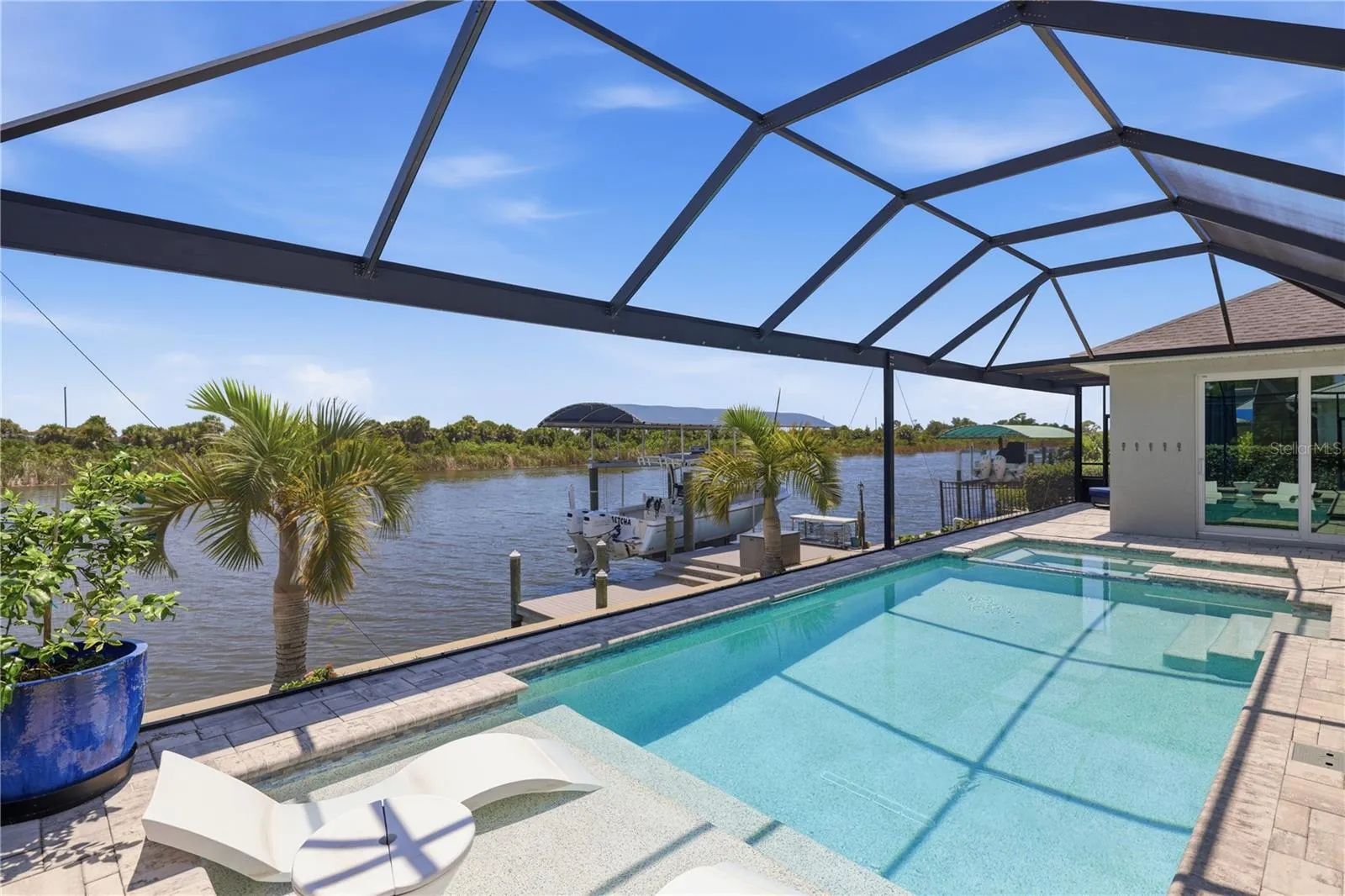 Heated Pool, with SunLedge, spa and large Lanai