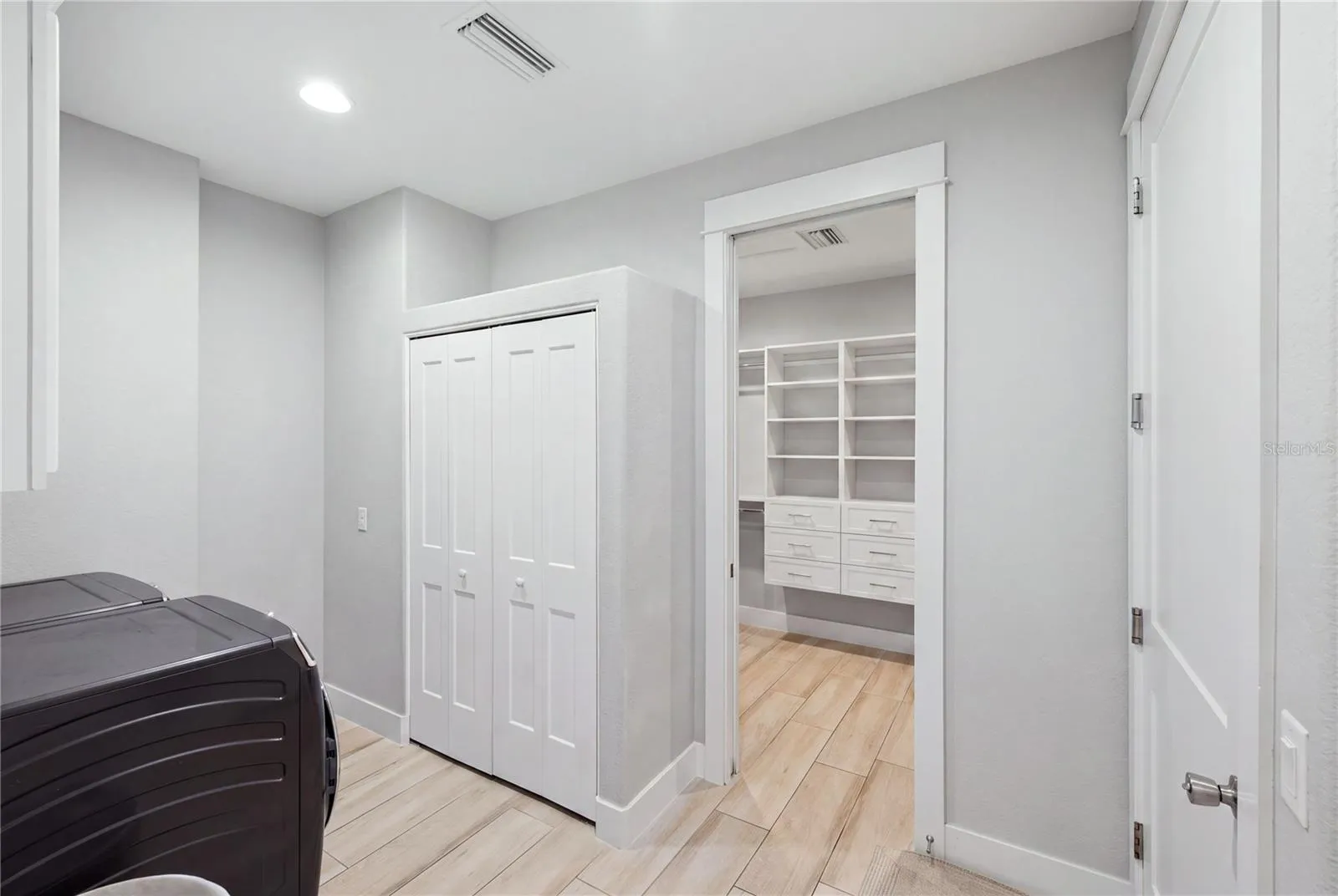 Laundry digitally decluttered- built in cabinets