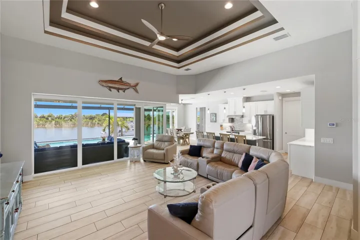 Open Greatroom with access to lanai and pool