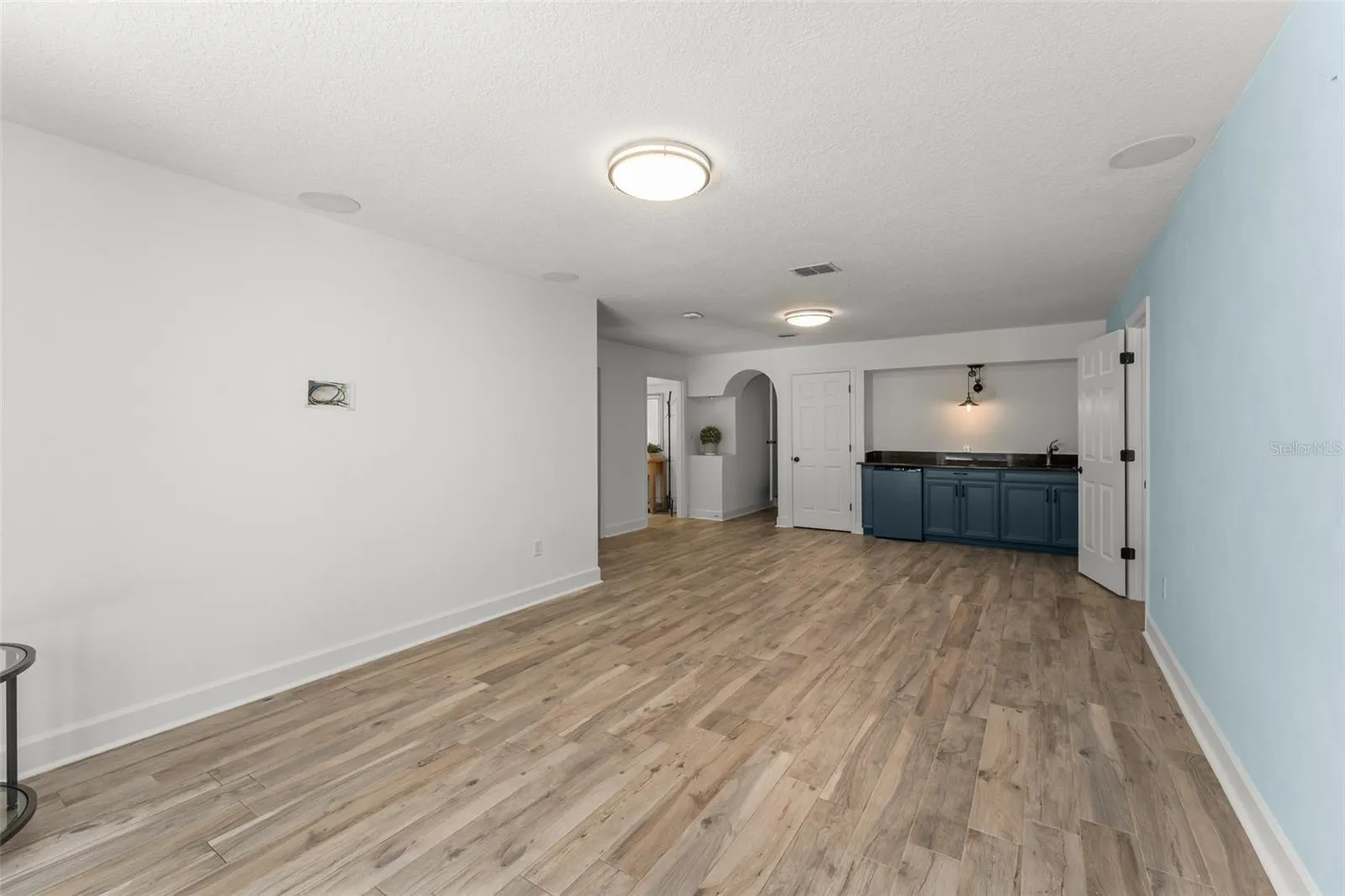Downstairs wet bar with mini fridge..