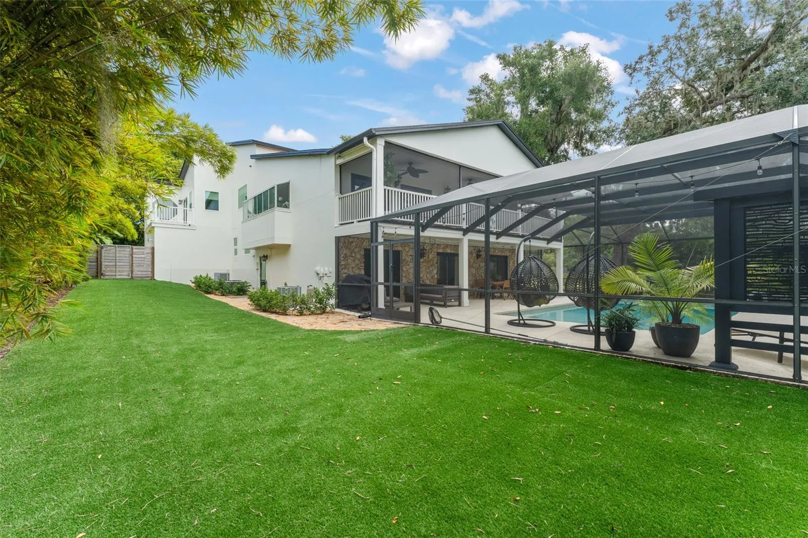 Large side yard with astroturf..