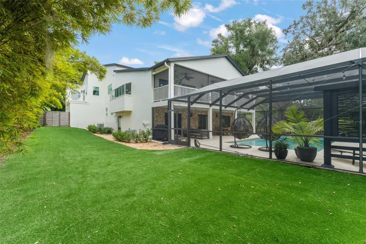 Large side yard with astroturf..