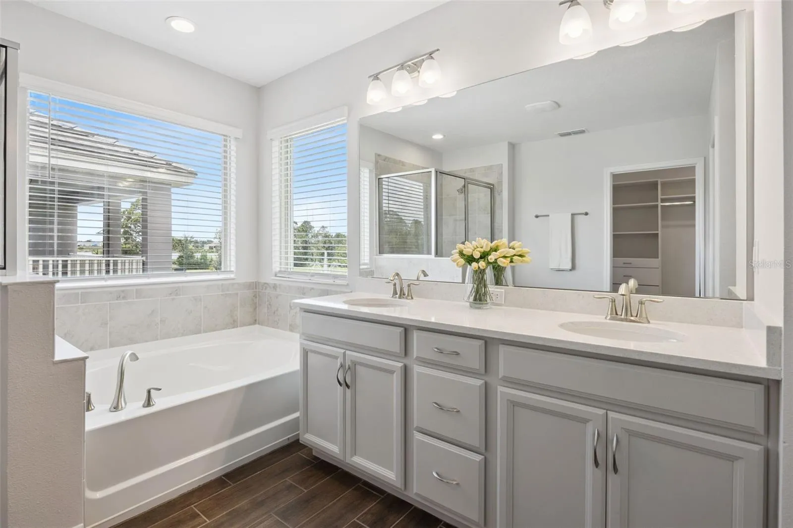 Primary bath vanity with dual sinks and garden tub