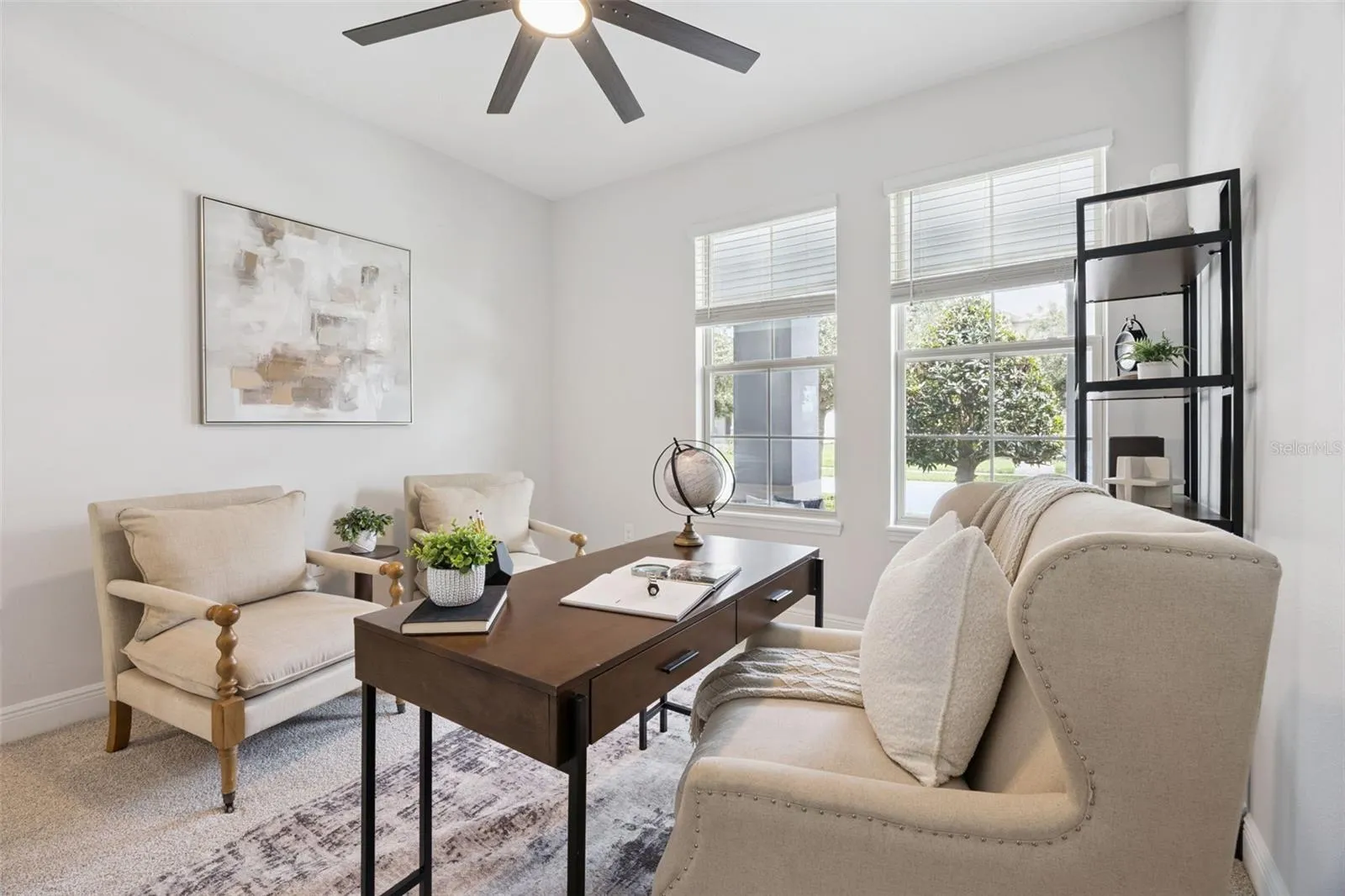 First-floor bedroom with ceiling fan, ideal as a home office