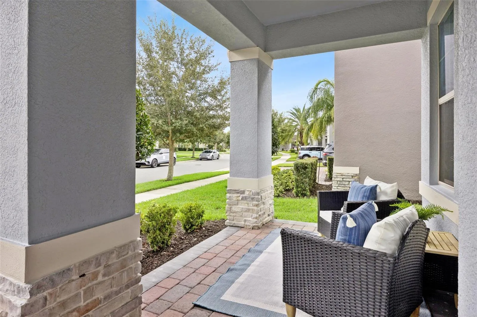 Covered front porch with stone-accented columns