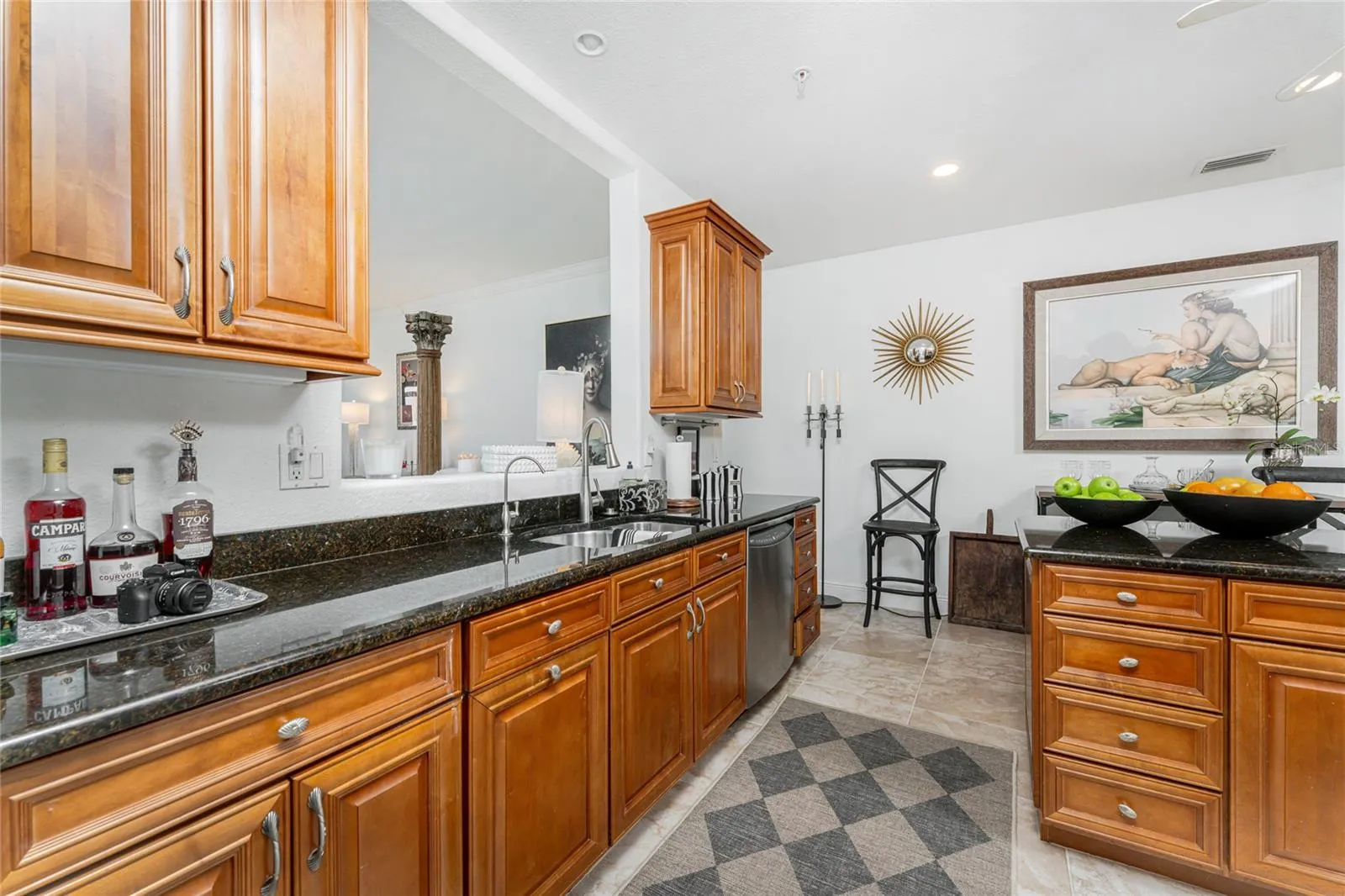 Beautiful solid wood cabinetry with soft close drawers cast a timeless understated warm ambiance throughout the home.