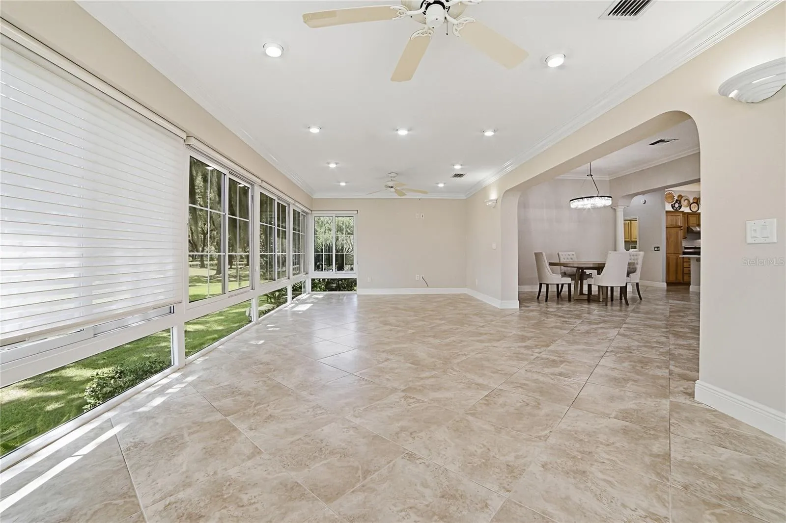 Florida room looking toward the formal dining and kitchen area