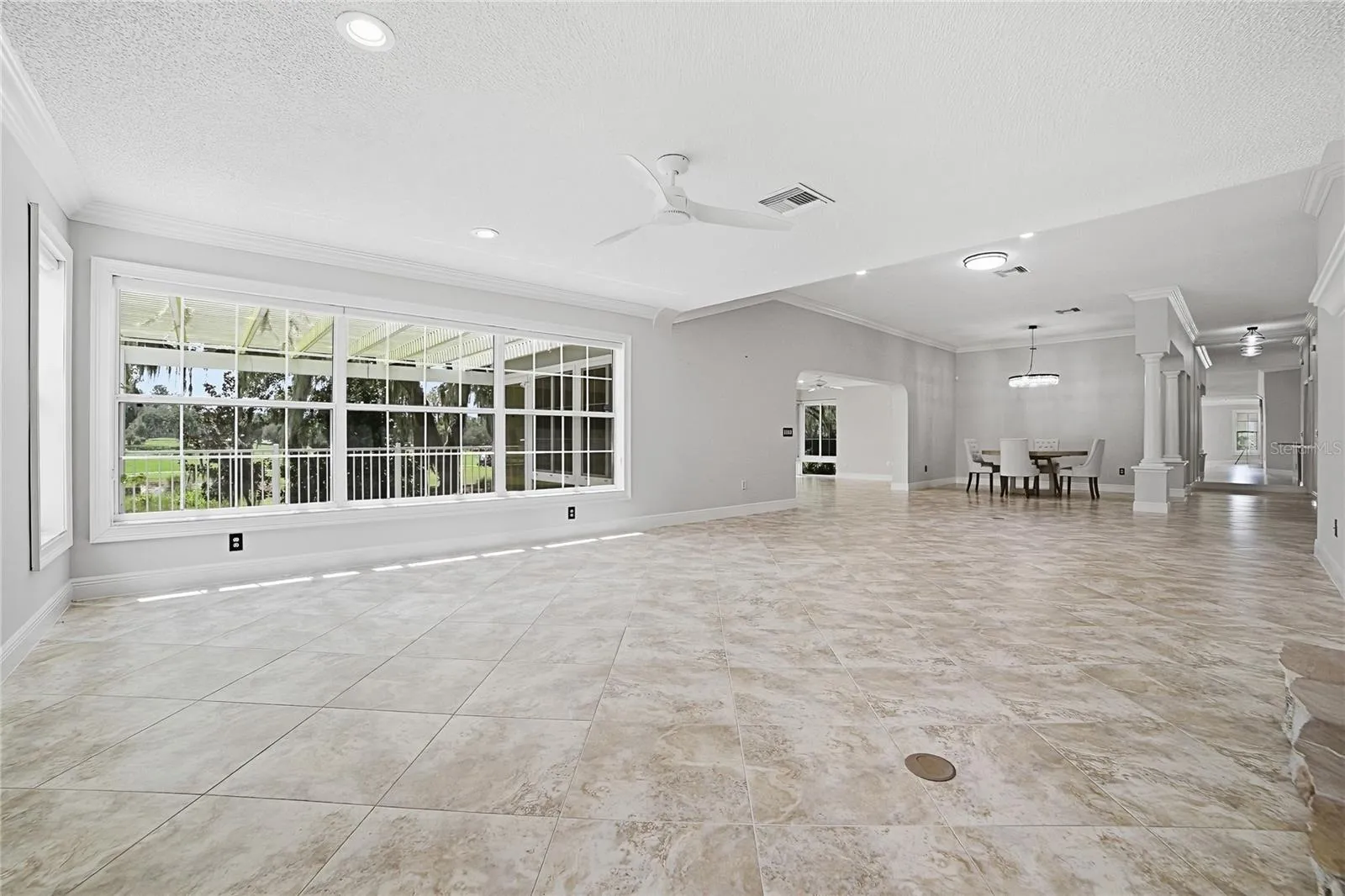 Living area looking toward dining are and outside
