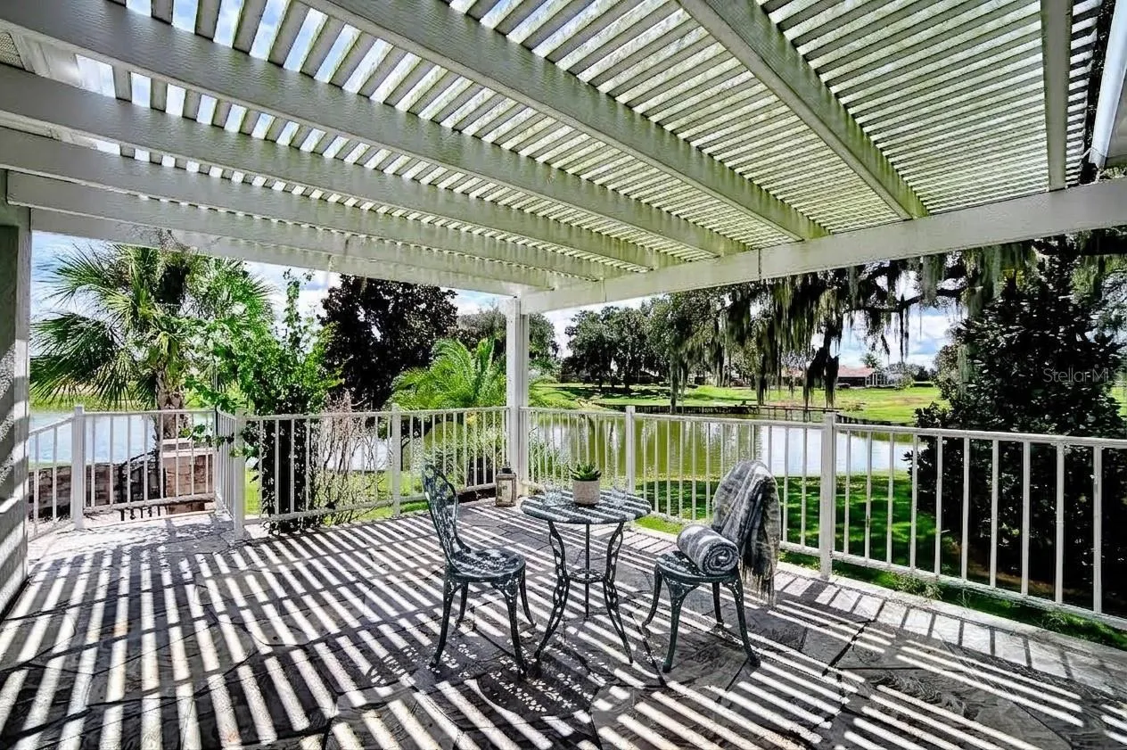 Pergola over back porch looking toward golf course