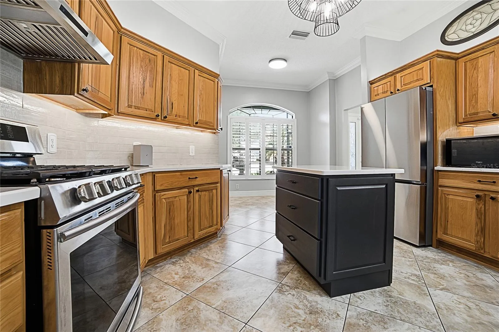 Kitchen looking toward front of house and breakfast area