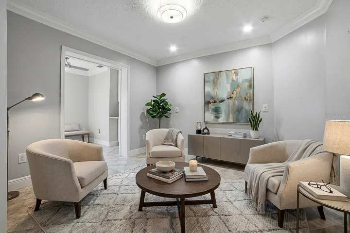 Third Bedroom front portion, virtually staged as sitting room