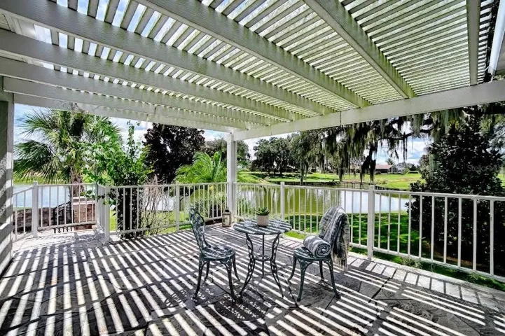 Pergola over back porch looking toward golf course