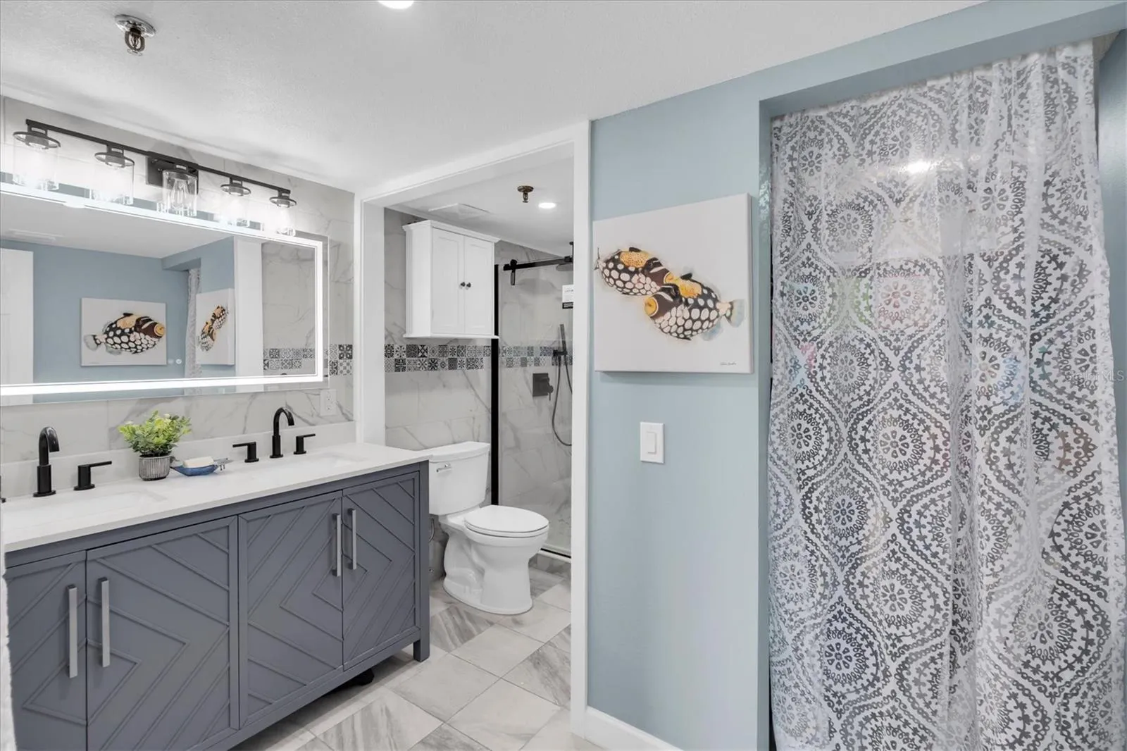 Spa-Inspired Primary Bath with Inlaid Tile Shower and Rain Showerhead