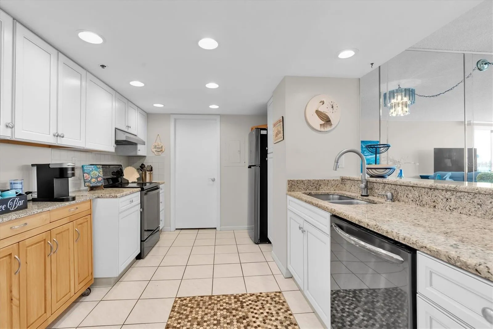 Open Kitchen with Water Views Beyond the Living Area