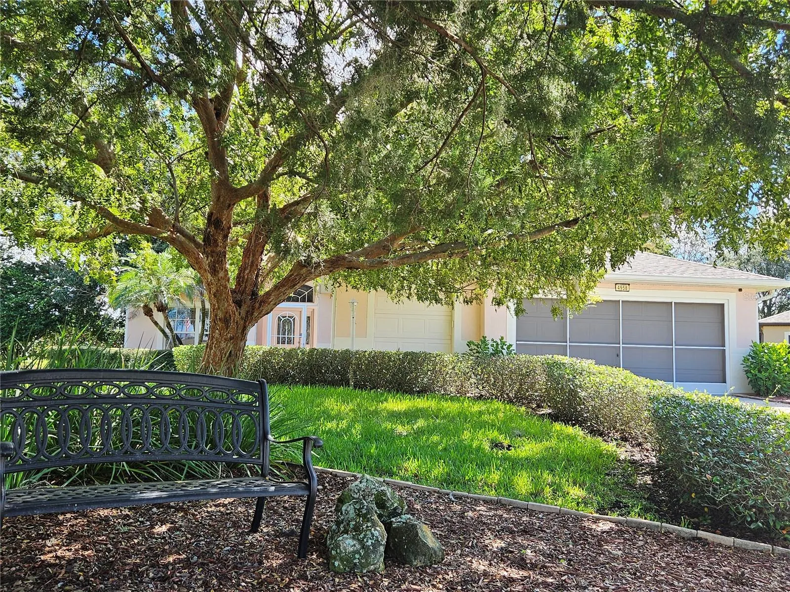Shady lot, 3 car garage!