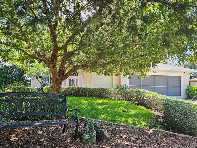 Shady lot, 3 car garage!