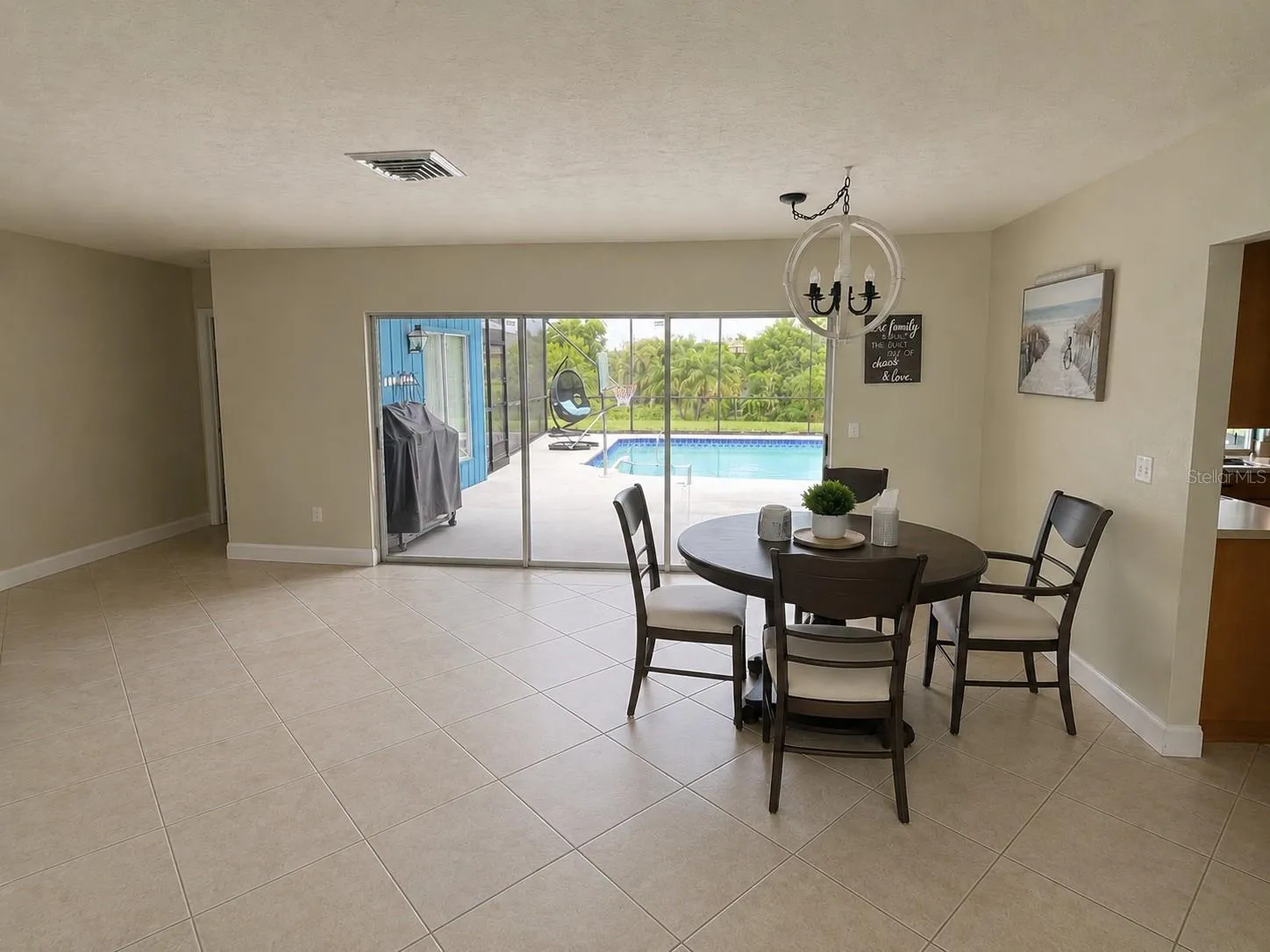 Living/dining area overlooking pool