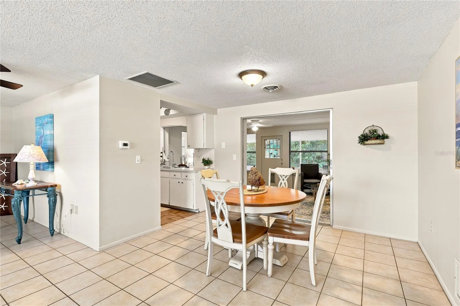 Dining area to Kitchen and leads to the Florida room or Family Room
