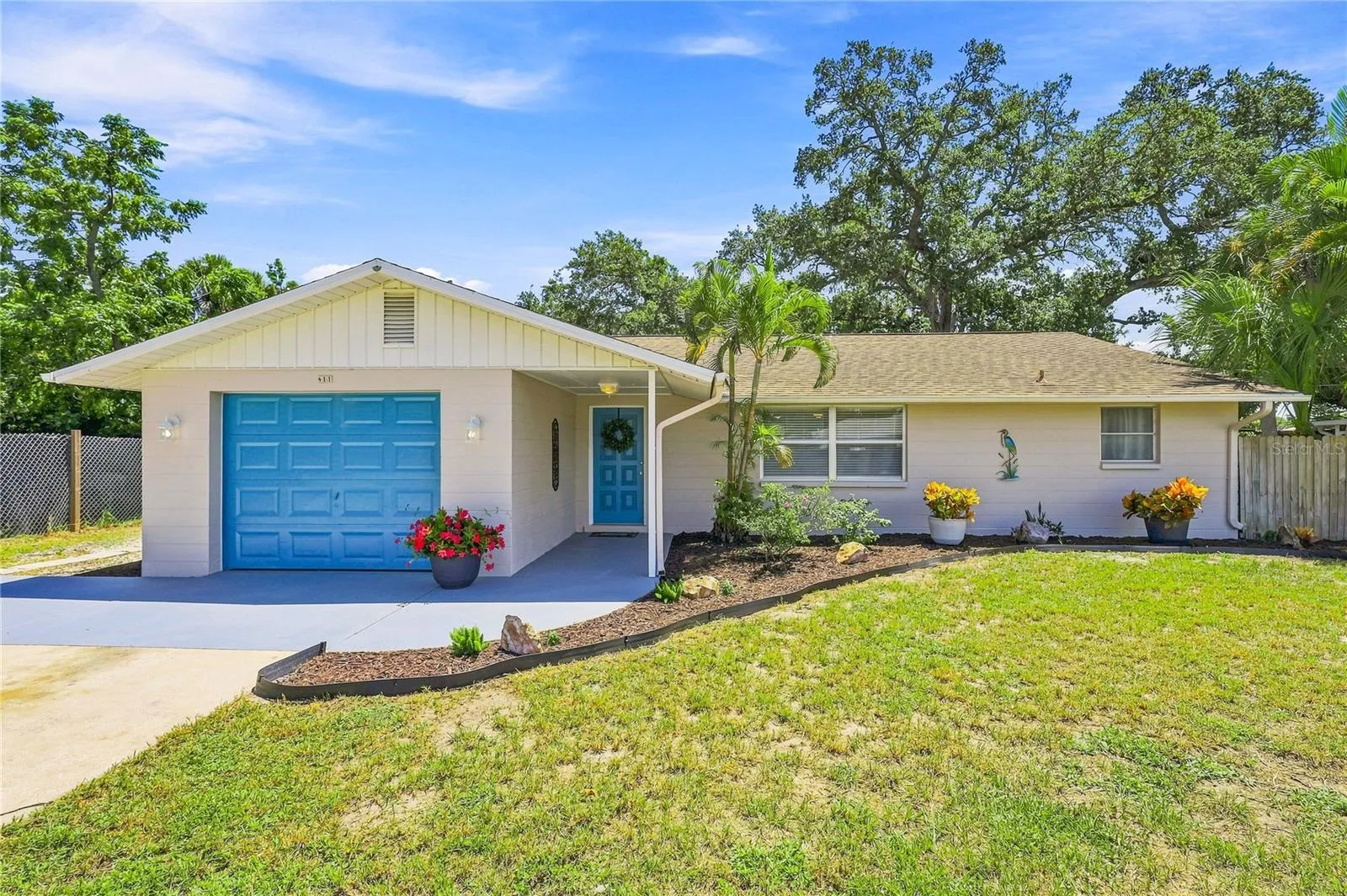 Welcome home to 411 Plantation Rd.  Freshly Painted Exterior, New Mulch and plants!