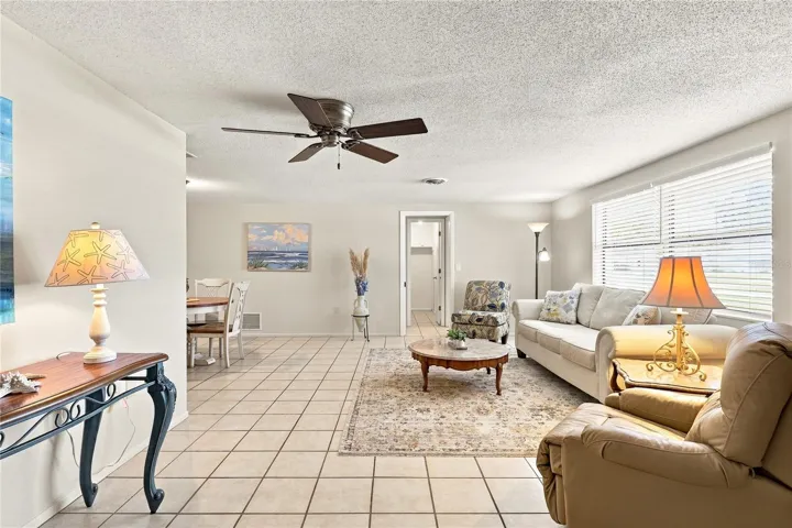 Living Area to Dining area.  Door goes to Owner's Suite