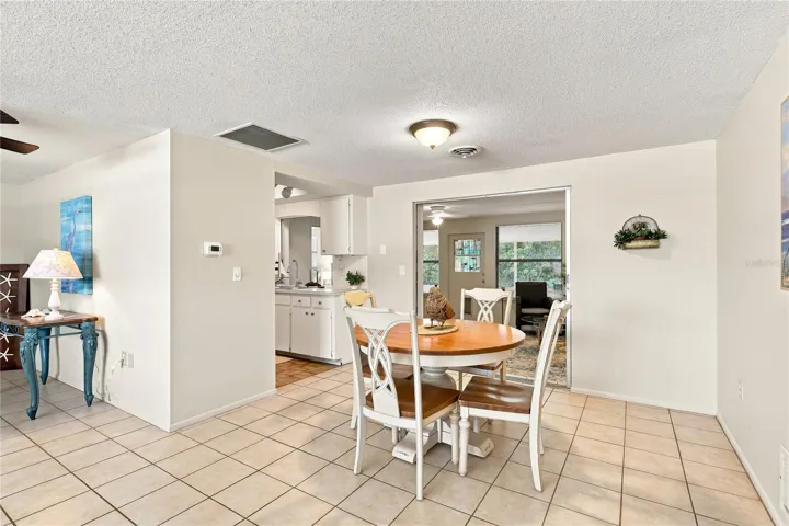 Dining area to Kitchen and leads to the Florida room or Family Room