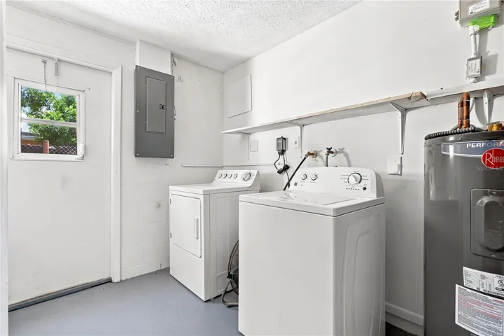Laundry Area off the garage that leads to outside.