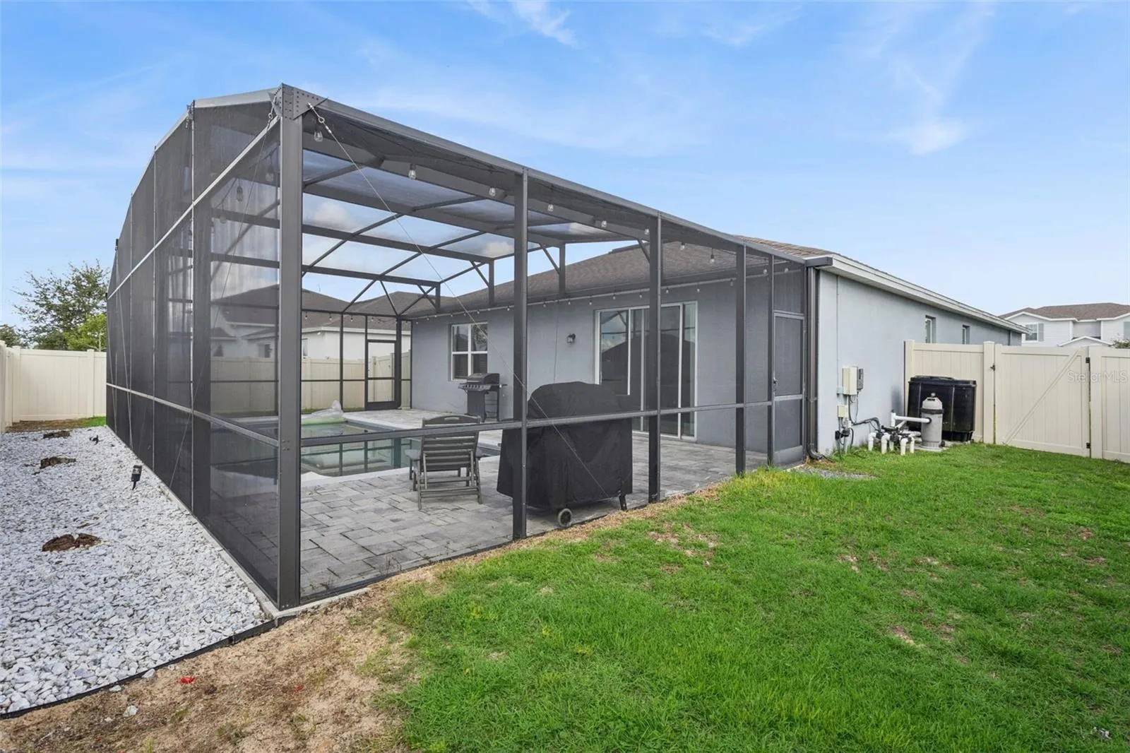 Screen-enclosed Pool Patio - backyard