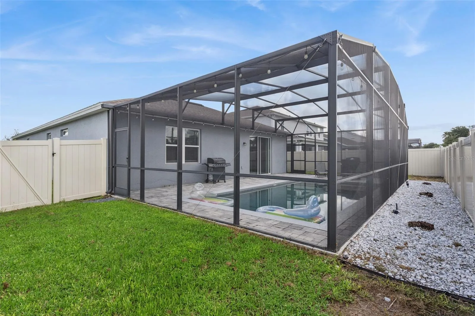 Screen-enclosed Pool Patio - backyard