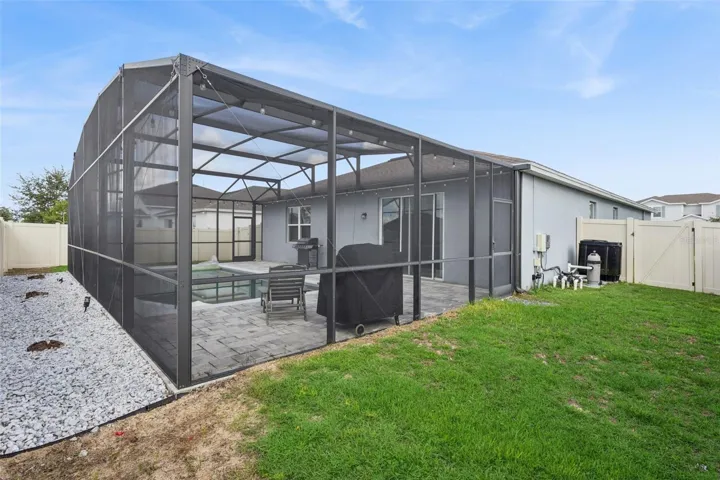 Screen-enclosed Pool Patio - backyard