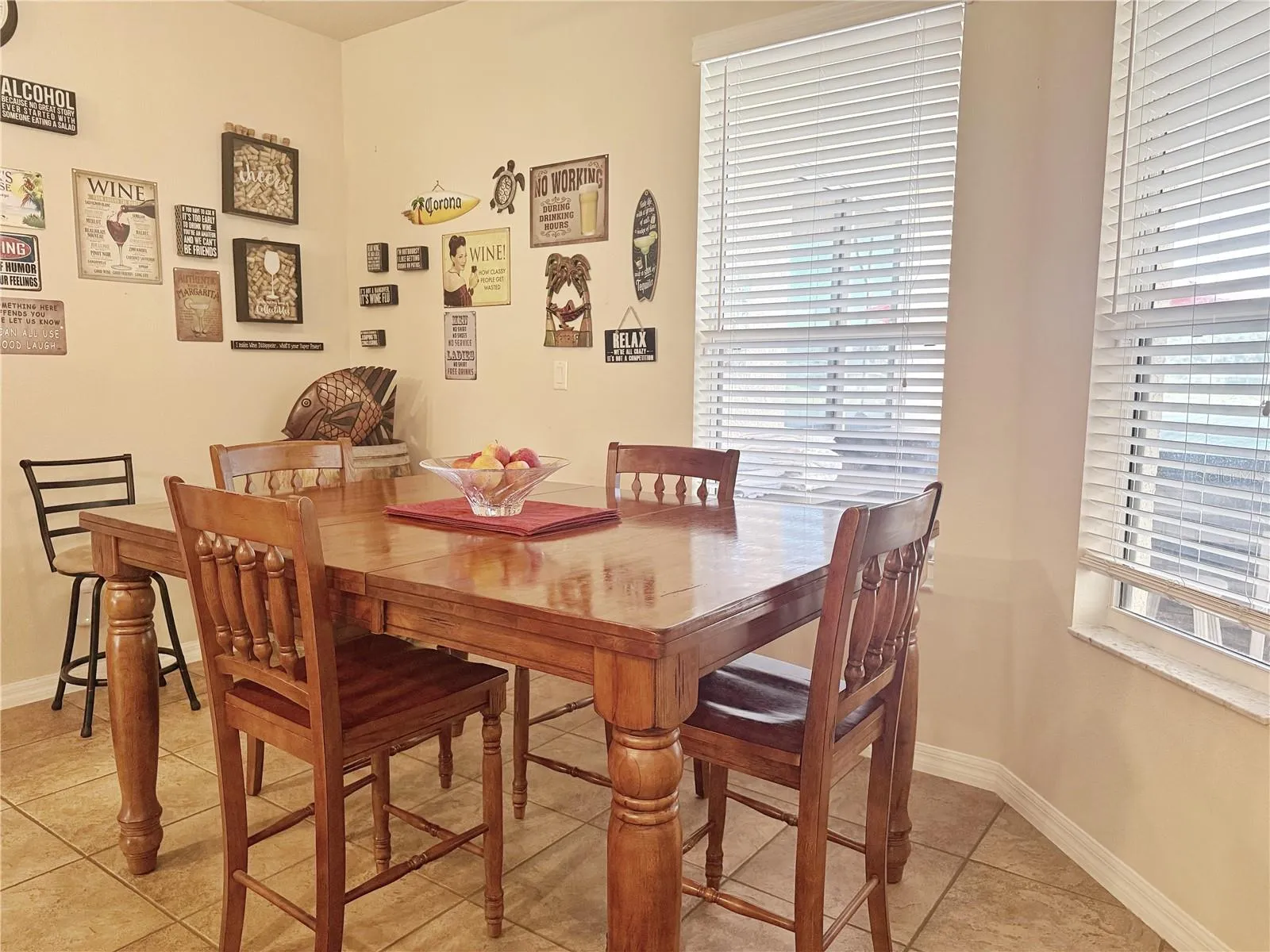 Kitchen Dinette with ceramic tile flooring, view of the pool and lake