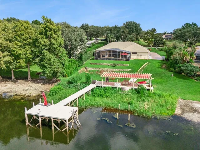 Aerial view of property with dock