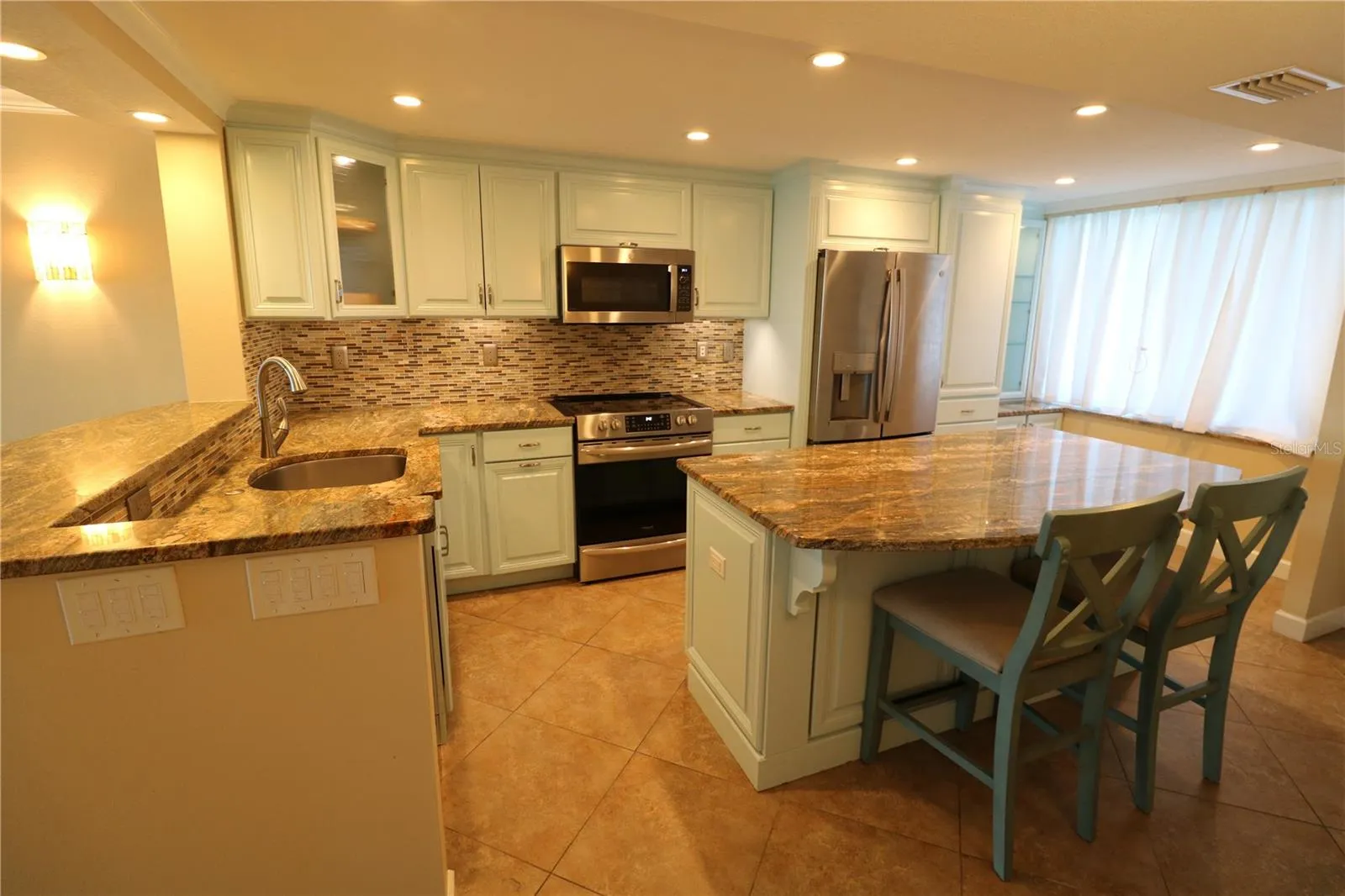 Large kitchen with quality cabinets and granite counters