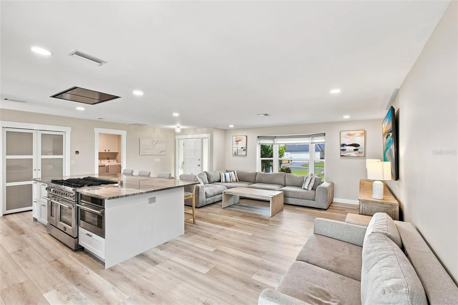 Kitchen and Living Room (oversized island, custom pantry, 8 burner gas range)