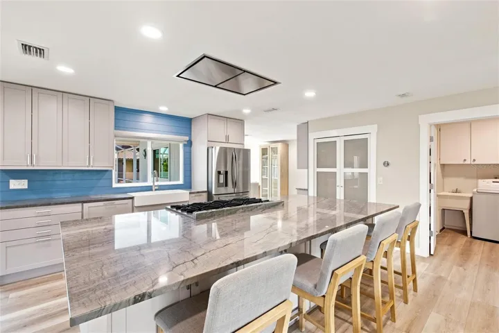 Kitchen (range vent, seating for 4, oversized island)