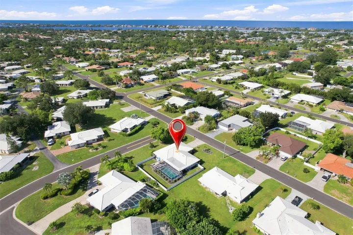 Aerial of home and neighborhood and close vicinity to beach