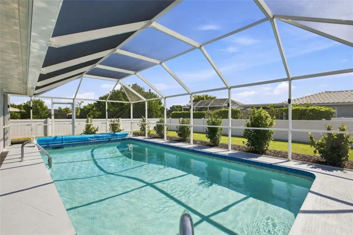 Pool with view of fenced yard