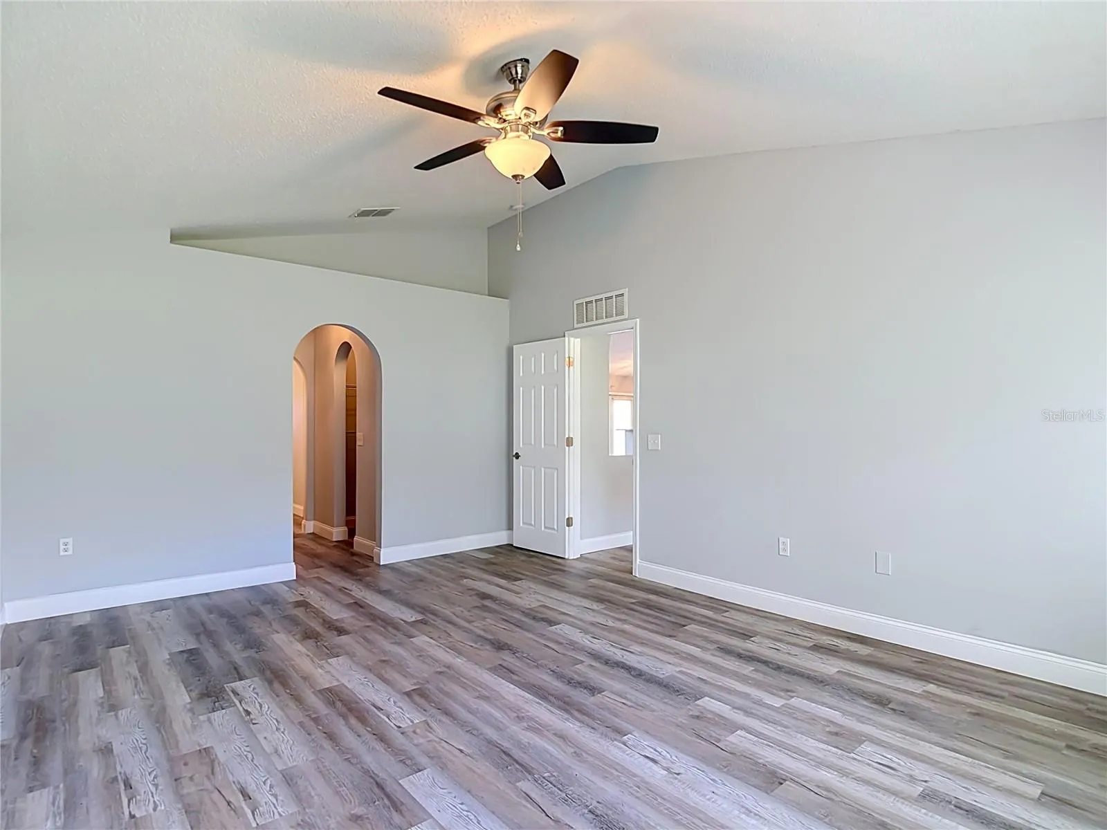Primary bedroom with two walk-in closets and en suite bathroom