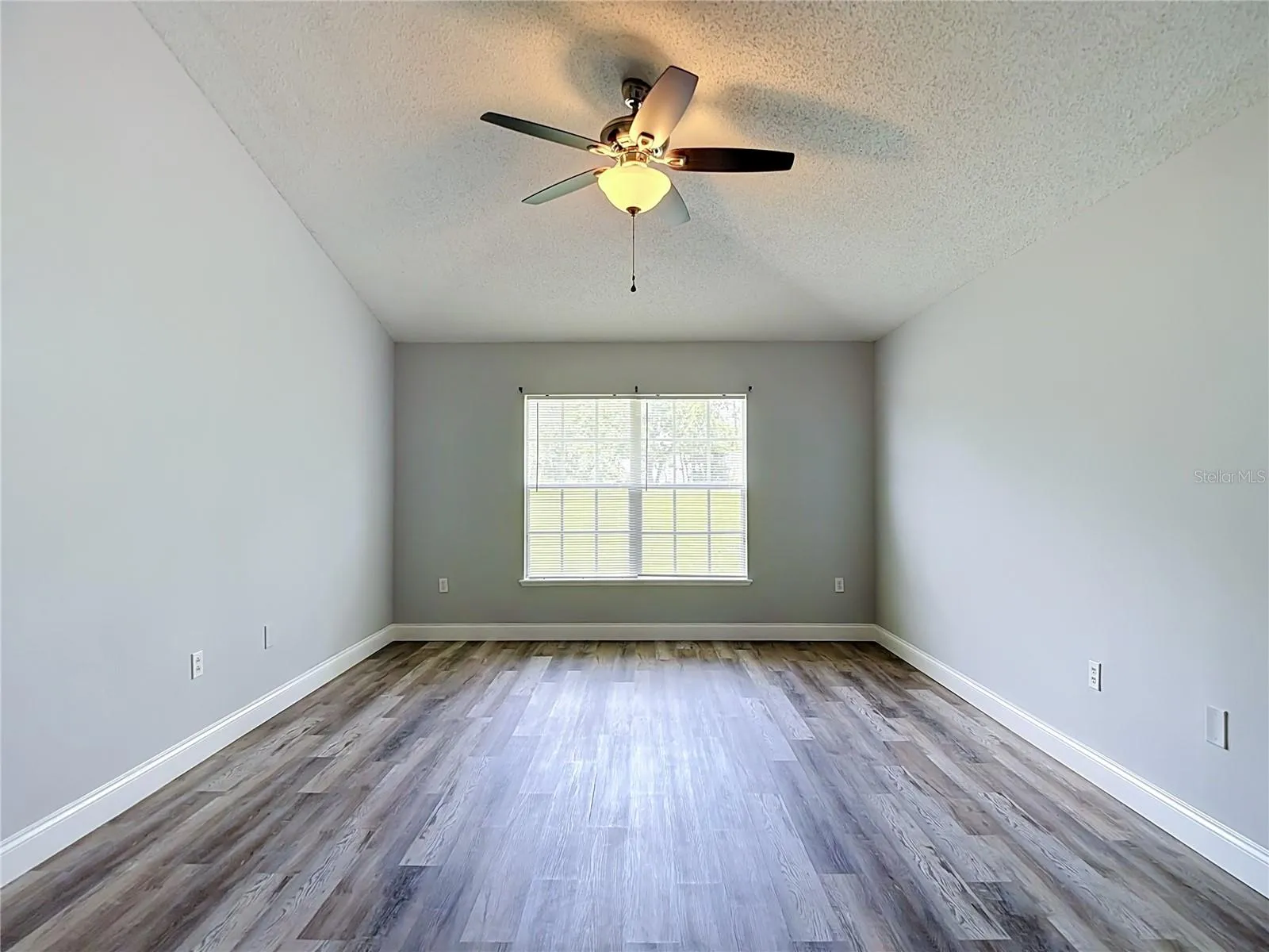 Primary bedroom with two walk-in closets and en suite bathroom