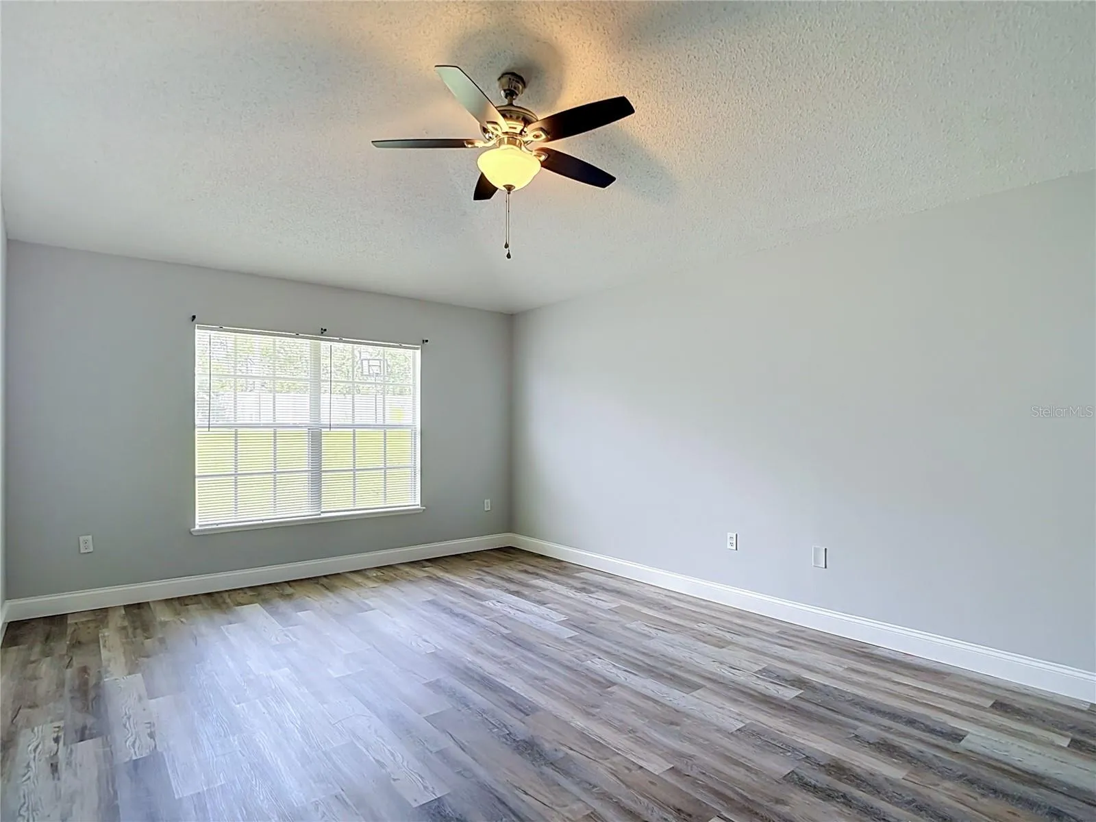 Primary bedroom with two walk-in closets and en suite bathroom