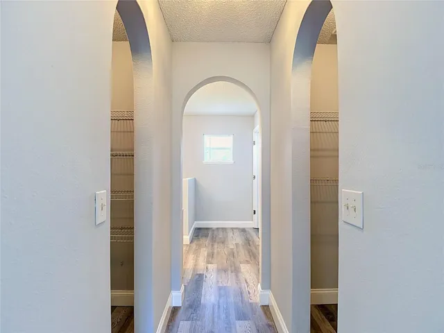 Primary bedroom with two walk-in closets and en suite bathroom