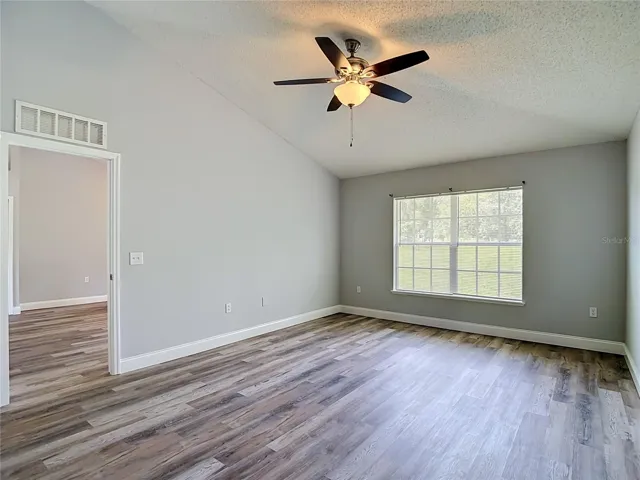 Primary bedroom with two walk-in closets and en suite bathroom