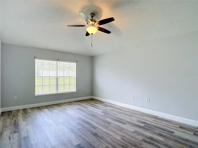 Primary bedroom with two walk-in closets and en suite bathroom