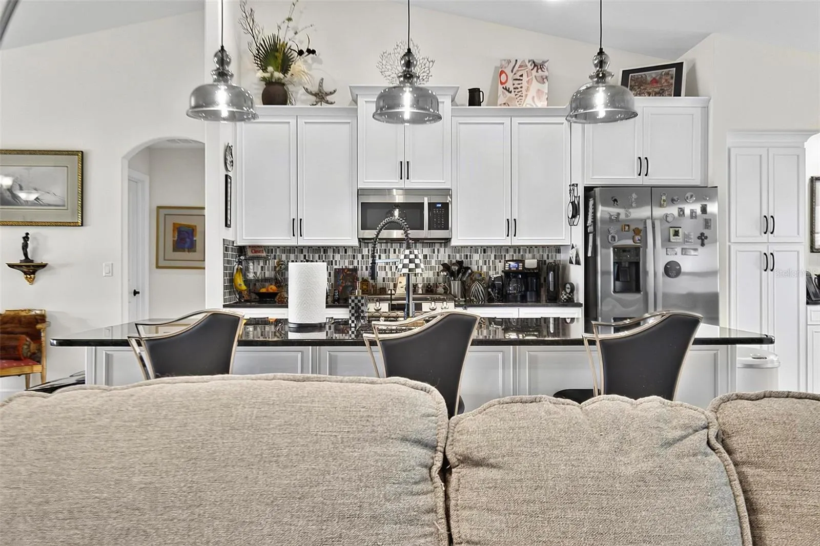 Large island with quartz counters and 42" cabinetry