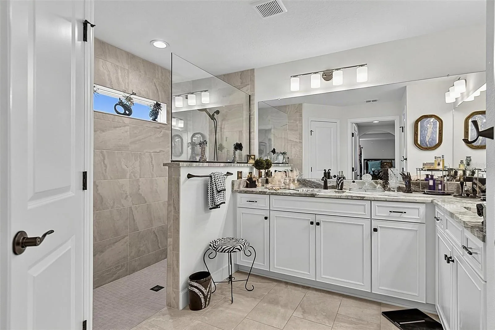 Luxury primary bathroom with large walk in shower