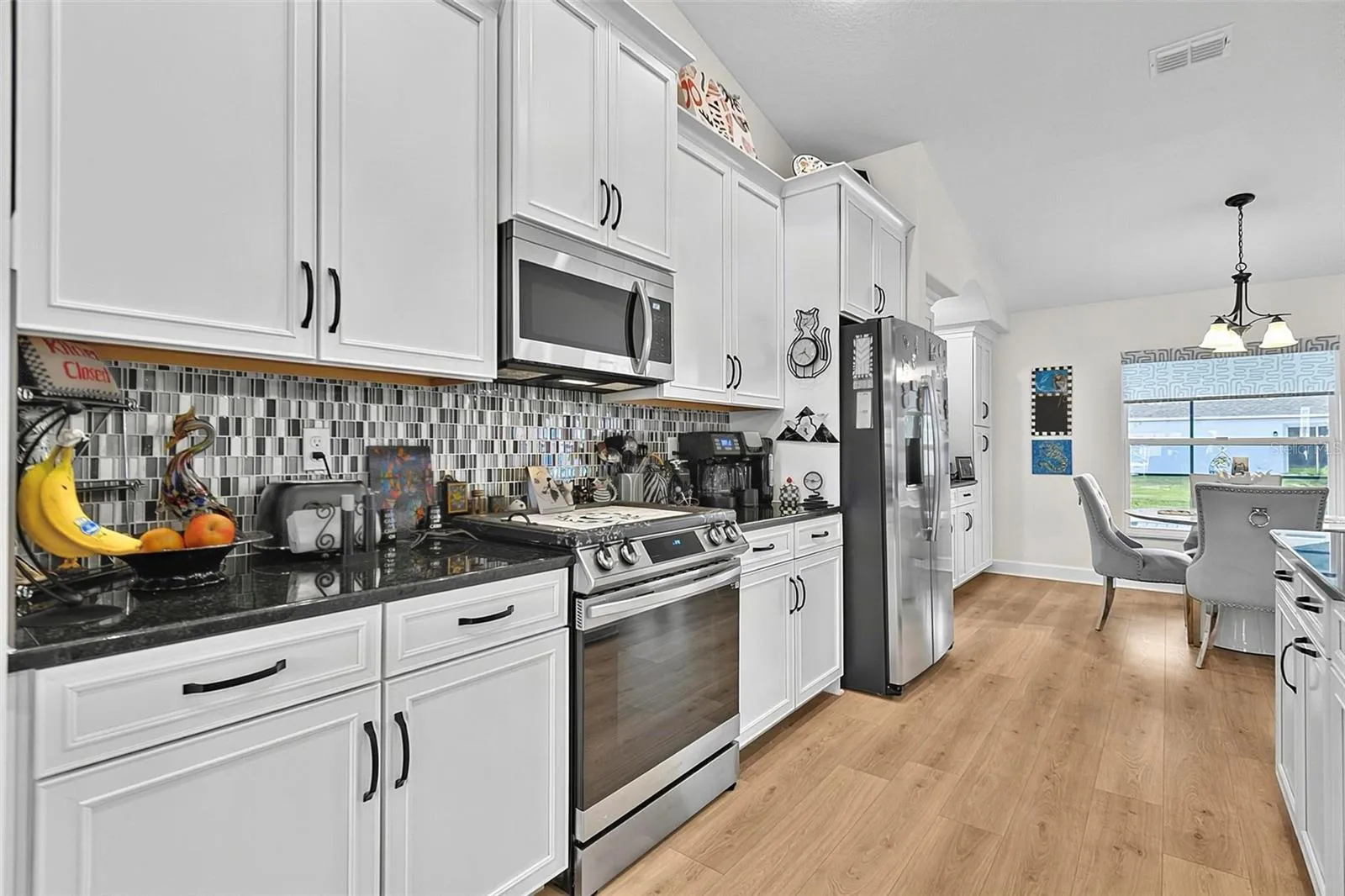 Soft close cabinets with Glass tile backsplash