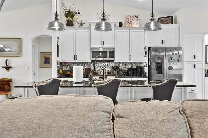 Large island with quartz counters and 42" cabinetry