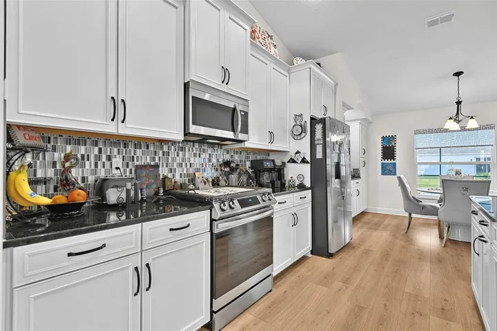 Soft close cabinets with Glass tile backsplash